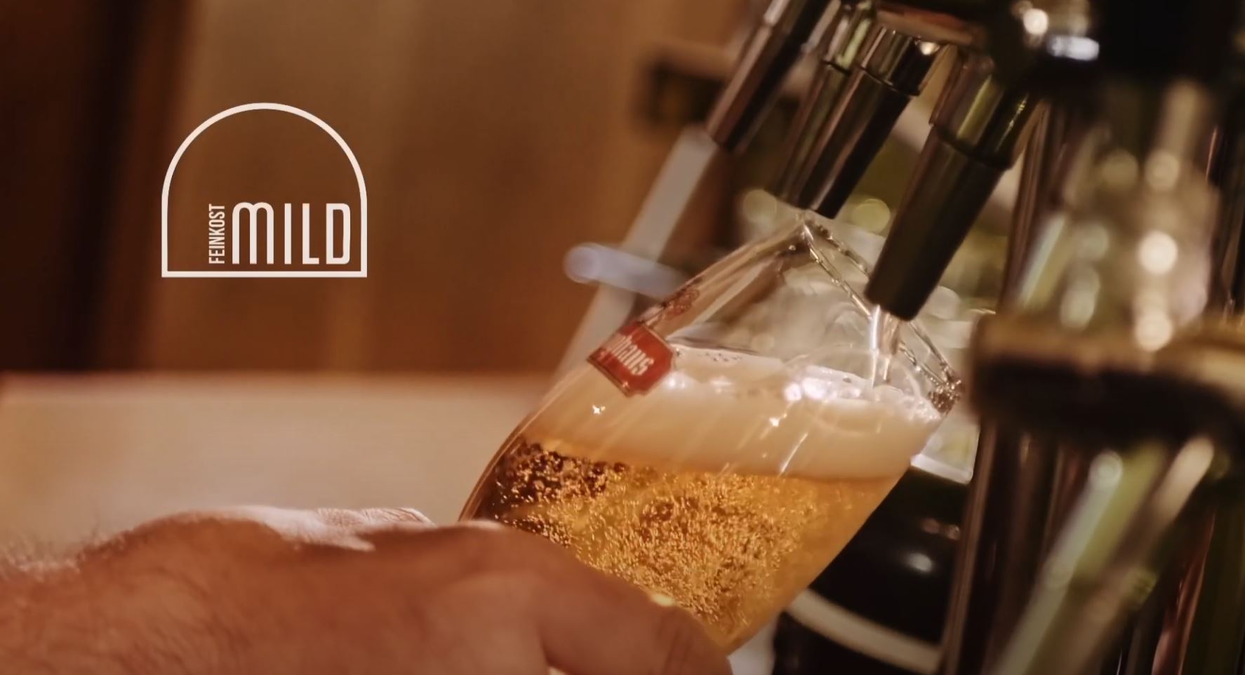 Feinkost Mild Video Screenshot with Logo & a Beer being poured